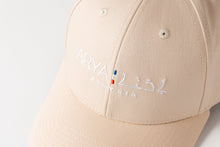 Load image into Gallery viewer, Cream and White ARYA ASSYRIA logo Baseball Cap